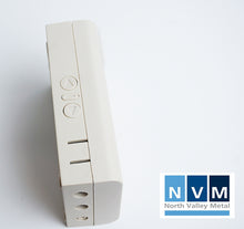 Load image into Gallery viewer, NVM remote control kit with two handsets / key fobs for roller shutters and garage doors showing side control buttons